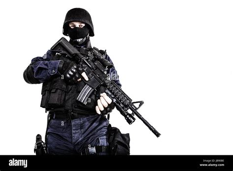 SWAT Soldier plays with his guns .